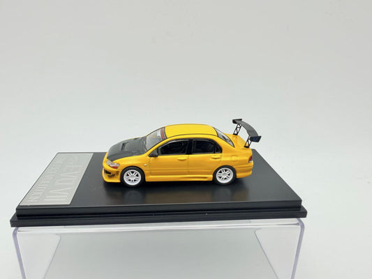 Mitsubishi Lancer EVO VII galben  cu vitrina plexiglass - 1/64 Fast & Speed