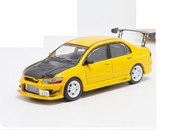 Mitsubishi Lancer EVO VII galben  cu vitrina plexiglass - 1/64 Fast & Speed