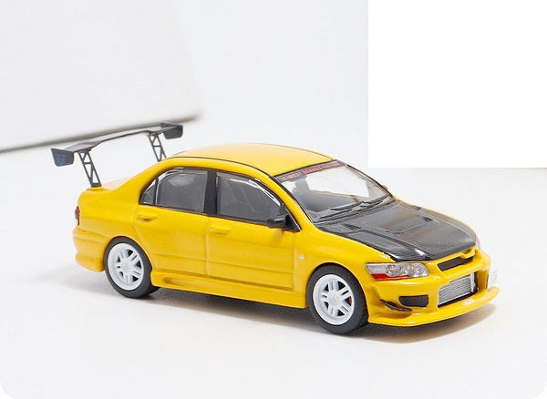 Mitsubishi Lancer EVO VII galben  cu vitrina plexiglass - 1/64 Fast & Speed
